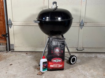 An 18' Original Kettle Charcoal Grill By Weber