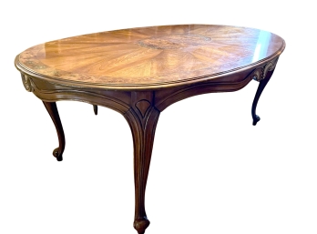 LOC 2 - An Oval French Provincial Inlayed Burled Band And Center Medallion - Flame Sunburst Dining Table