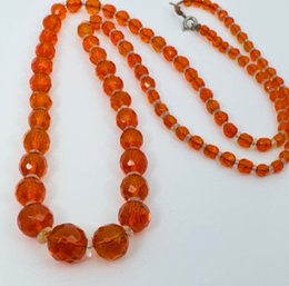 VINTAGE GRADUATED ORANGE FACETED AND CLEAR BEAD NECKLACE