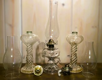 Antique Oil Lamps And Two Chimney's