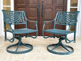 A Pair Of Cast Aluminum Swivel Chairs By Cast Classics