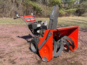 A Snow King 12 HP Snow Blower