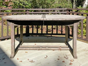 A Fine Quality Extendable Teak Outdoor Dining Table