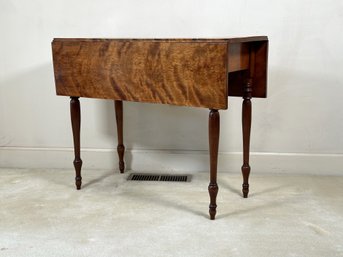 An Antique Drop-Leaf Table In Flame Birch With Gorgeous Wood Grains