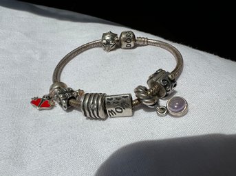 Pandora Sterling Charm Bracelet With Seven Charms, Weighs 33g