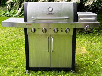A Char Broil Stainless Propane Grill - With Cover