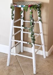 A Custom Painted Stool With Trellis And Leaf Motif