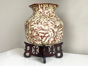 An Antique Ceramic Vessel On Rose Wood Base