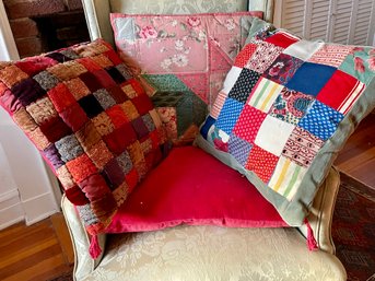 A Collection Of  Hand Sewn Quilted Throw Pillows & One Solid Red Velvet With Corner Tassels