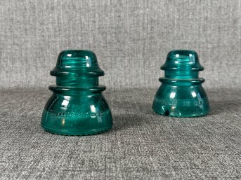 A Pair Of Vintage Glass Insulators By Hemingray In Blue