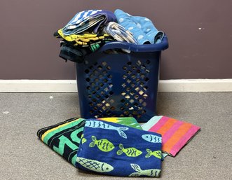 A Tall Laundry Basket Full Of Towels #1