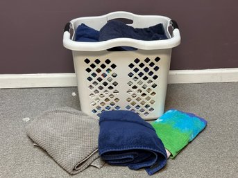 A Tall Laundry Basket Full Of Towels #2