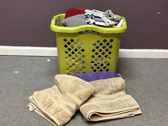A Tall Laundry Basket Full Of Towels #3