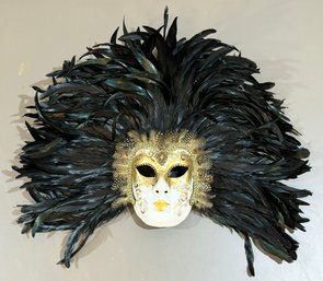 A Vintage Hand Painted Ceramic And Feathered Venetian Carnival Mask