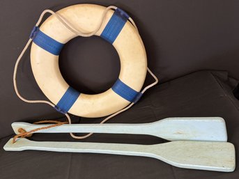 Vintage Life Preserver And Two Decorative Oars