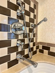 A Chrome Finish Tub Filler - Handheld Shower And Mixing Valves