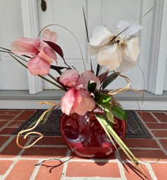 Decorative Faux Flowers In Burgundy Colored Ceramic Container