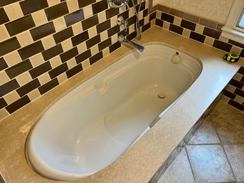 An Ultra Bain Fiber Glass Champagne Jet Tub