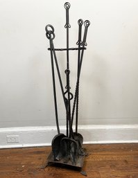 A Set Of Antique Wrought Iron Fireplace Tools