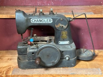 A Vintage Button Sewing Machine By Chandler