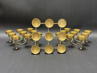 Three Contemporary Votive Holders In Gold-Toned Metal
