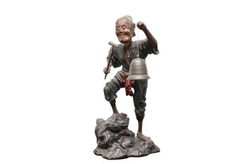 Asian Peasant Male Figure With Red Sash Large Bell And Hammer On Rock