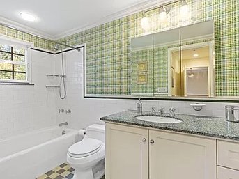 A Granite Top Vanity With Kohler Sink