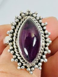 PRETTY STERLING SILVER AND AMETHYST RING