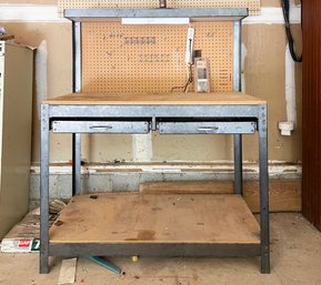 A Good Quality Metal And Wood Work Bench And Peg Board Above