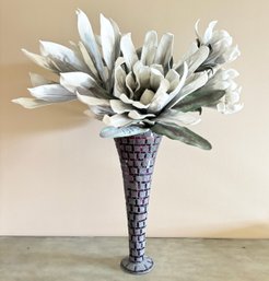A Large Contemporary Faux Floral Arrangement In Art Metal Vase