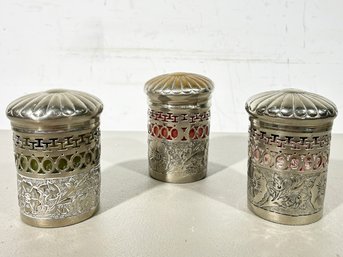 A Trio Of Silver Plated Spice Jars With Colored Glass Inserts