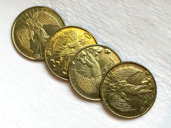 A Group Of Gold Toned Angel And Halo Coins Or Tokens