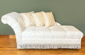 An Attractive Chaise Lounge With Fringe Skirting