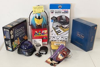 Vintage NOS Electronic And Board Games Incl. 1981 Trivial Pursuit, The Original Potty Piano, & Much More