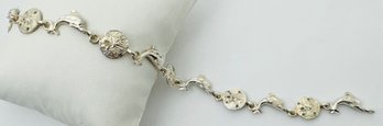 SIGNED NF STERLING SILVER DOLPHIN AND SAND DOLLAR BRACELET