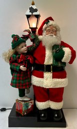Vintage Christmas Lighted Animated Santa Child - Heads Move - Fabric Plastic - Realistic - 27 1/8 X 12 1/2 X 7