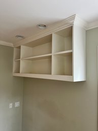 A  Built-In Wall Mounted Shelf  With Undershelf Lighting