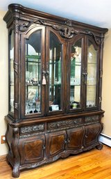 An Ornately Carved China Cabinet 'Essex Manor' By Michael Amini - Glass Shelves And Silver Cloth Lined Drawers