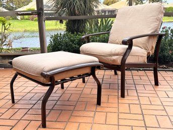 An Outdoor Arm Chair And Ottoman By Tropitone