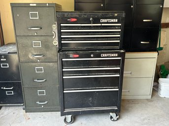 A Black Craftsman Tool Chest With Many Tools