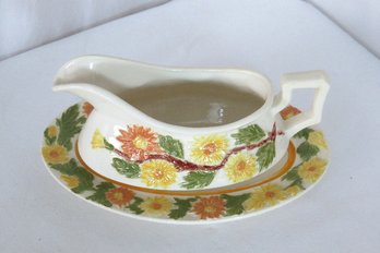 A Floral Pattern Ceramic Gravy Boat And Tray Set