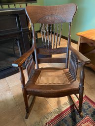Antique Oak And Wicker Seat Rocking Chair.