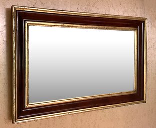 An Antique Ogee Mirror With Parcel Gilt Banding