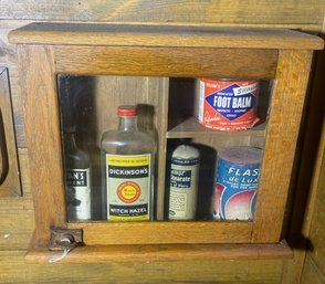 Cute Glass Front Wood Cabinet With Vintage Bottles And Containers