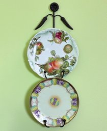 A Pair Of Antique Porcelain Plates On Plate Rack