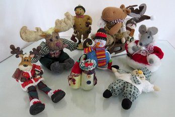 A Grouping Of Holiday Plush Figurines And Ornaments