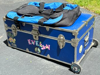 A Rolling Travel Trunk With Snap On Duffel