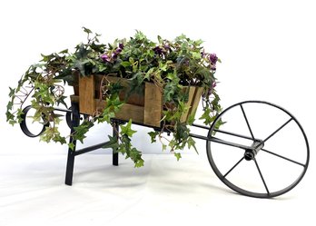 Faux Greenery In Wheelbarrow Planter