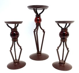 A Trio Of Art Metal And Glass Candle Holders