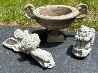 A Group Of Cast Stone Garden Ornaments Including An Urn